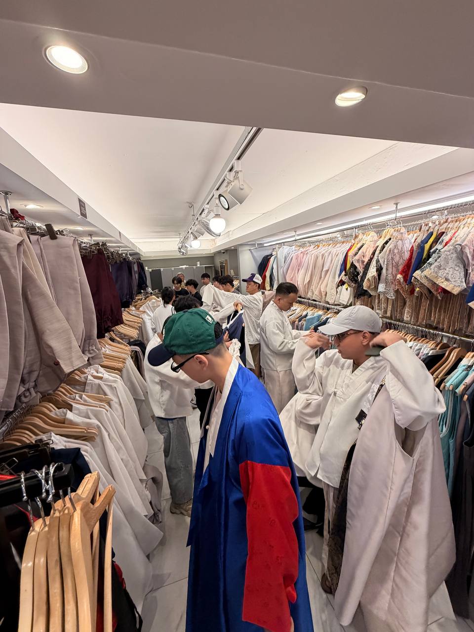 Artist Hanbok fitting room men trying on traditional robes Seoul