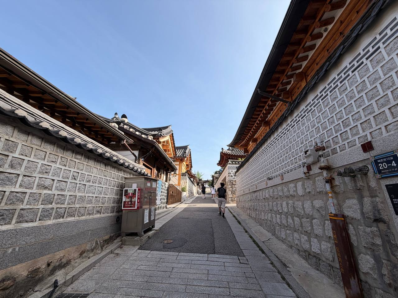 Bukchon alley pedestrians morning Jongno Seoul