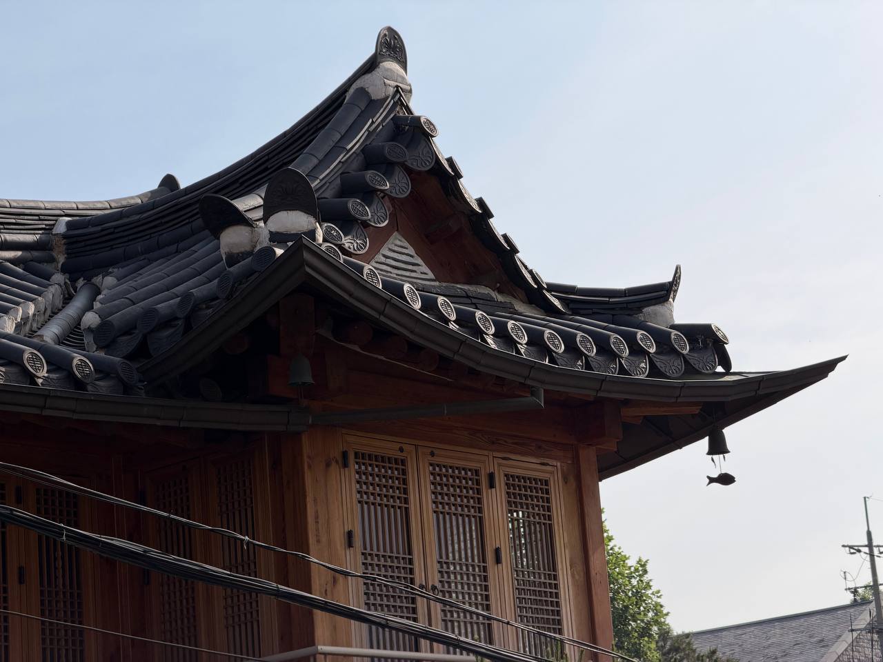 Bukchon hanok curved giwa roof tiles wind chime Seoul