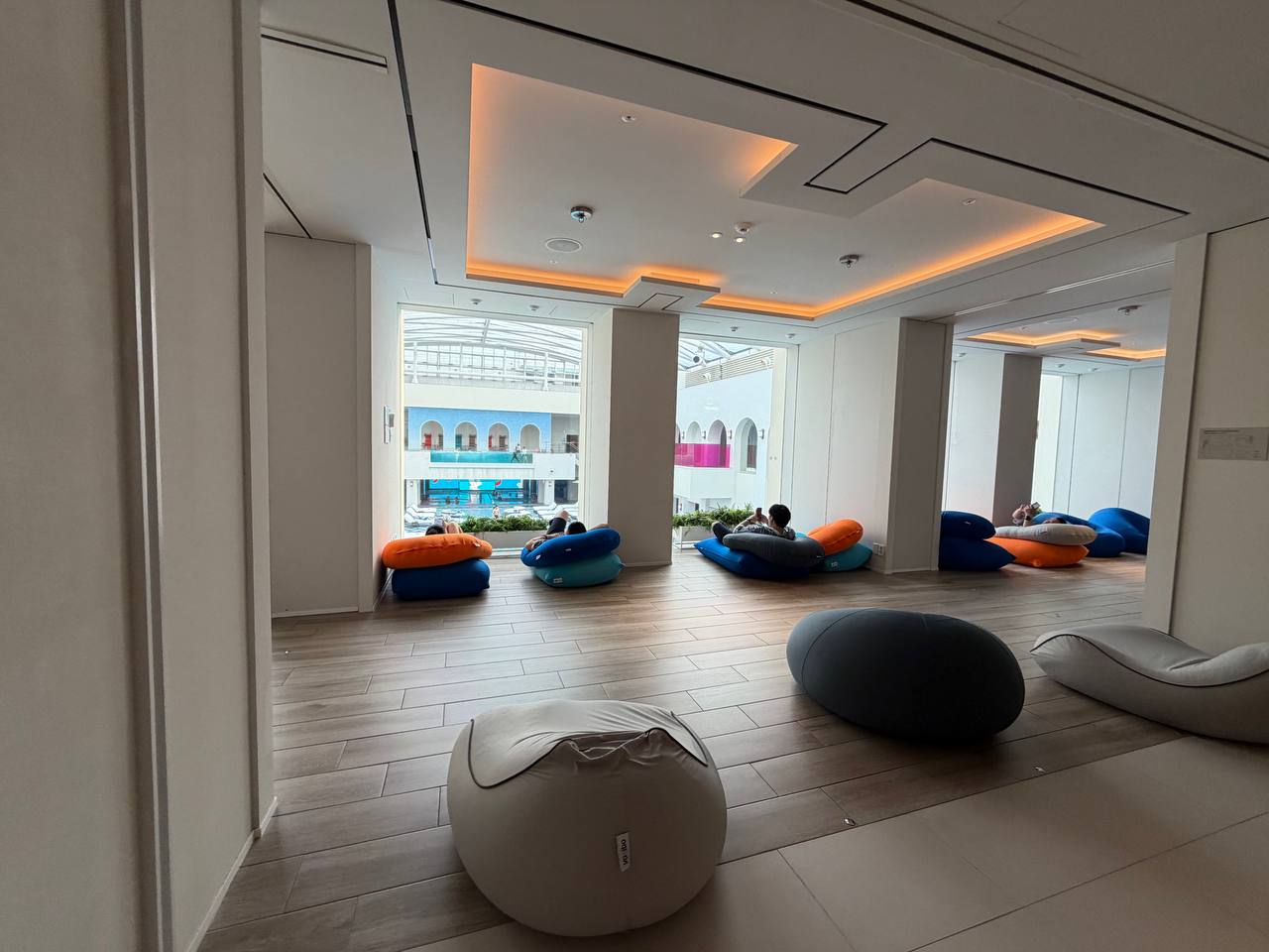 Cimer Spa beanbag lounge with pool view at Paradise City