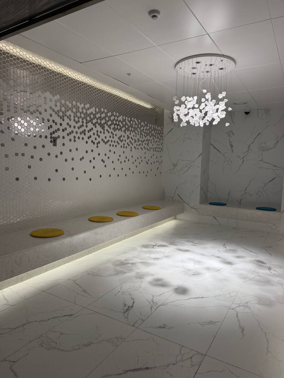 Cimer Spa crystal chandelier cooling room with marble and mosaic wall