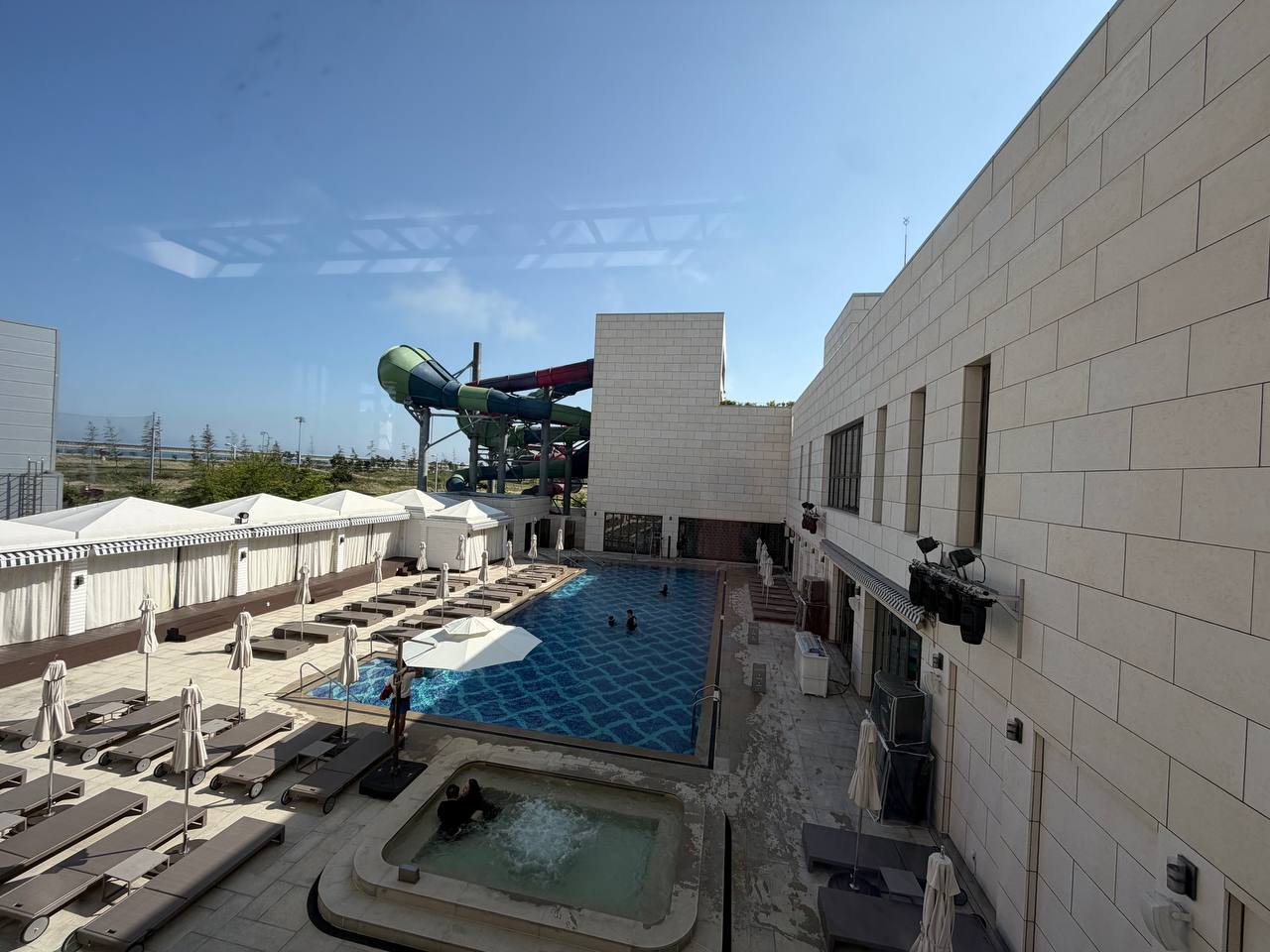 Cimer Spa outdoor area with water slide complex in background