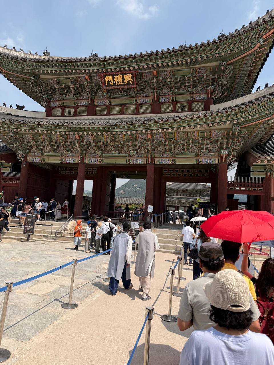 Heungnyemun Gate tourists entering Gyeongbokgung Palace Seoul