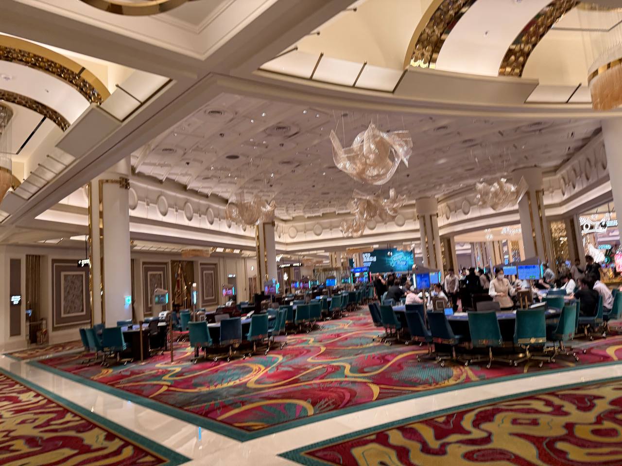 Paradise City casino floor with ornate gold ceilings and art installations