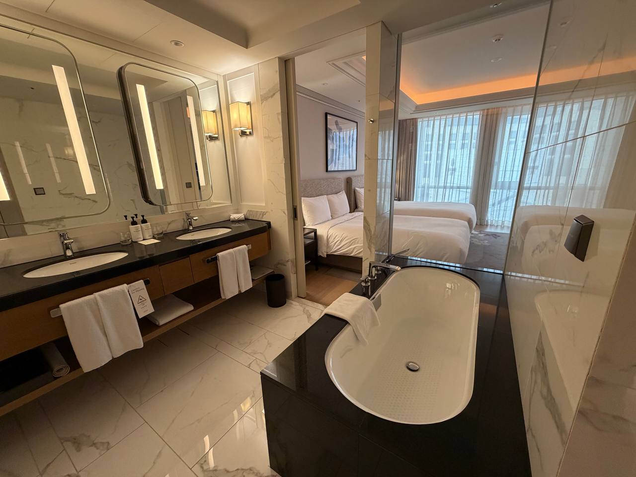 Paradise City Hotel bathroom with freestanding tub and double vanity