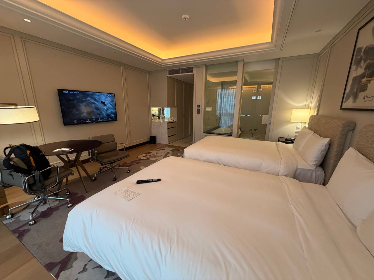 Paradise City Hotel guest room with two beds and marble bathroom