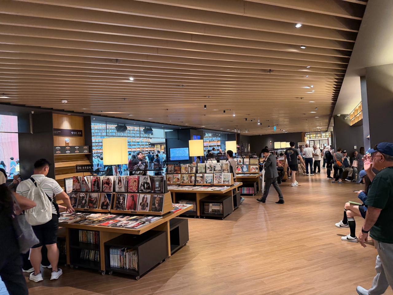 Starfield Library Seoul interior magazine reading area books tables