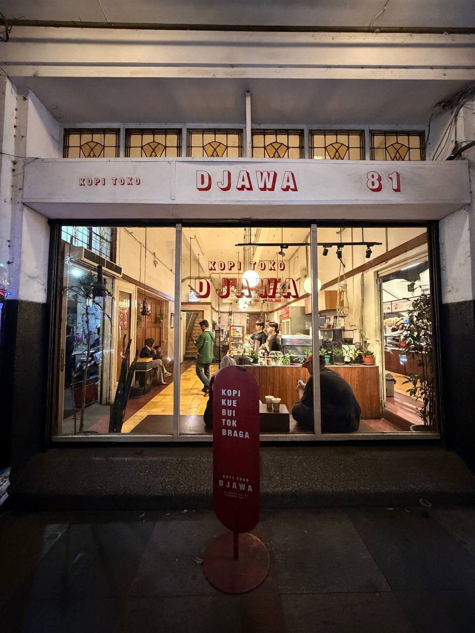 Kopi Toko Djawa 81 at night — heritage coffee house with warm lighting on Jalan Braga, Bandung