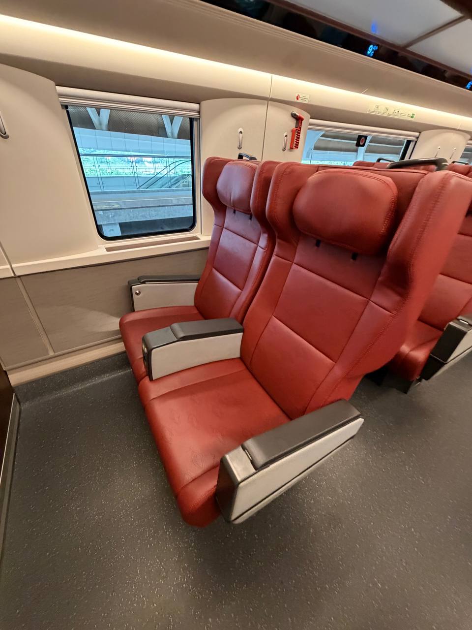 Whoosh train first class red leather seats beside the window — KCIC400AF interior