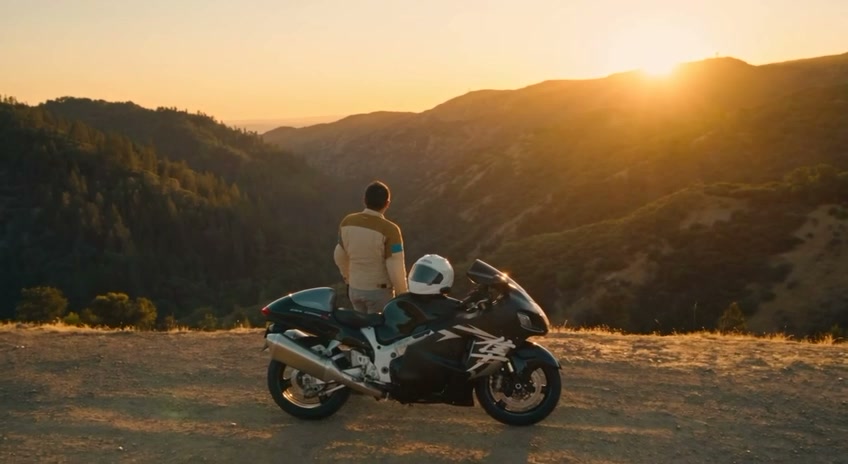 Rear three-quarter view of the motorcycle at the overlook, AI-generated, showing tail section and exhaust